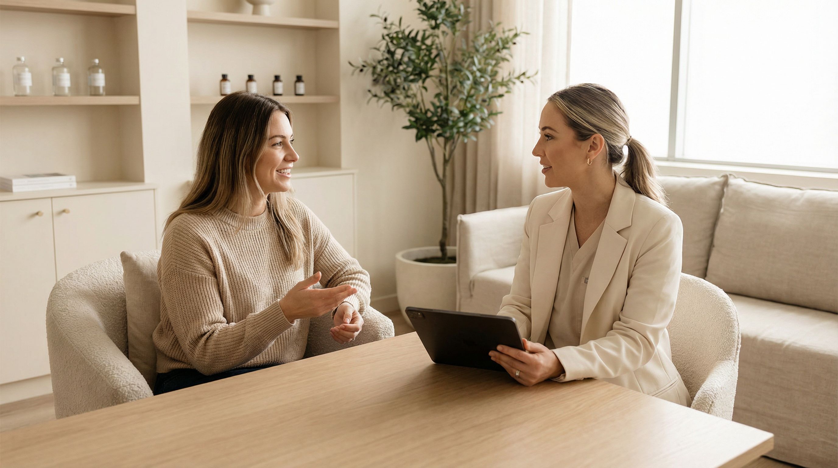 Woman at aesthetic clinic consultation discussing trap Botox treatment with provider